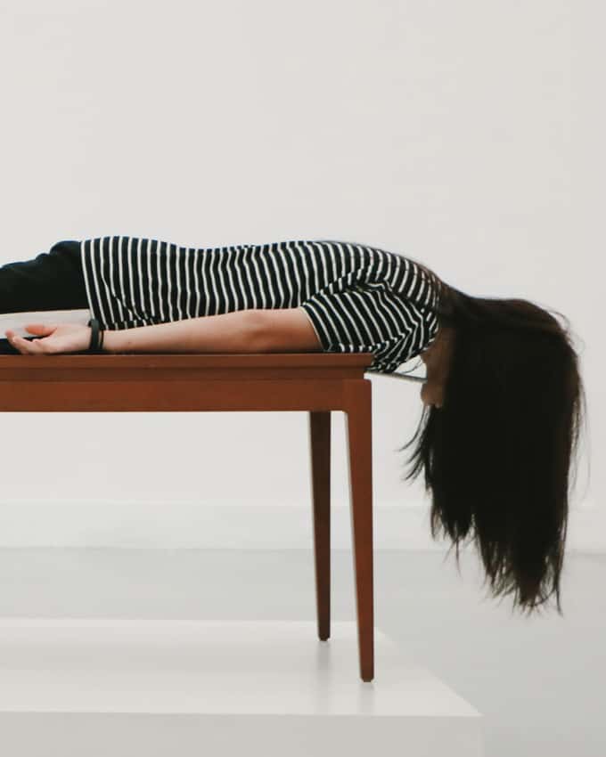 Girl laying down on a table